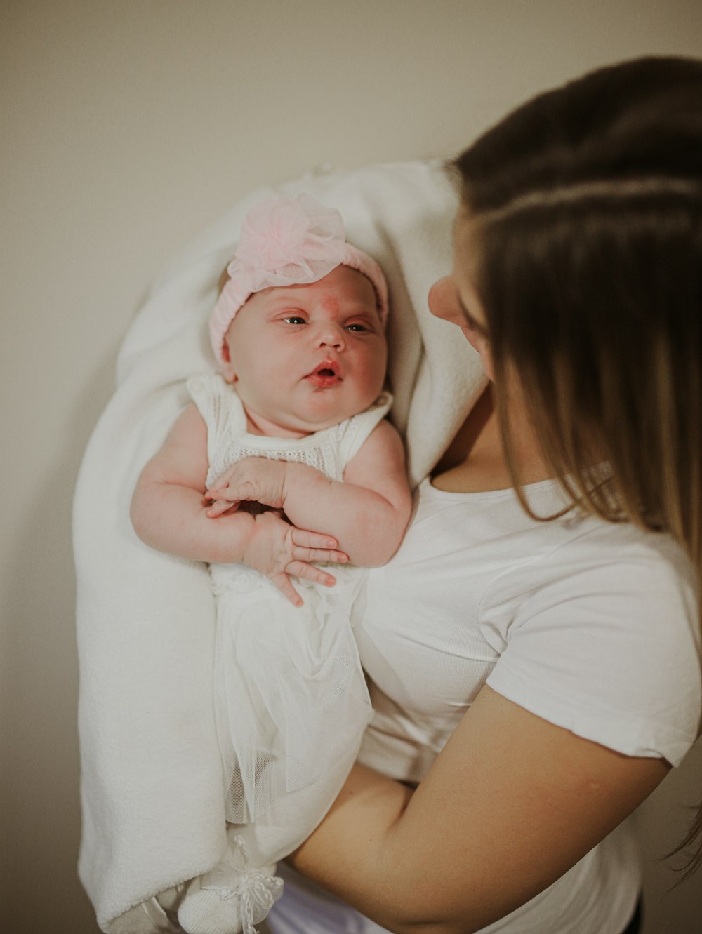 a woman holding a baby