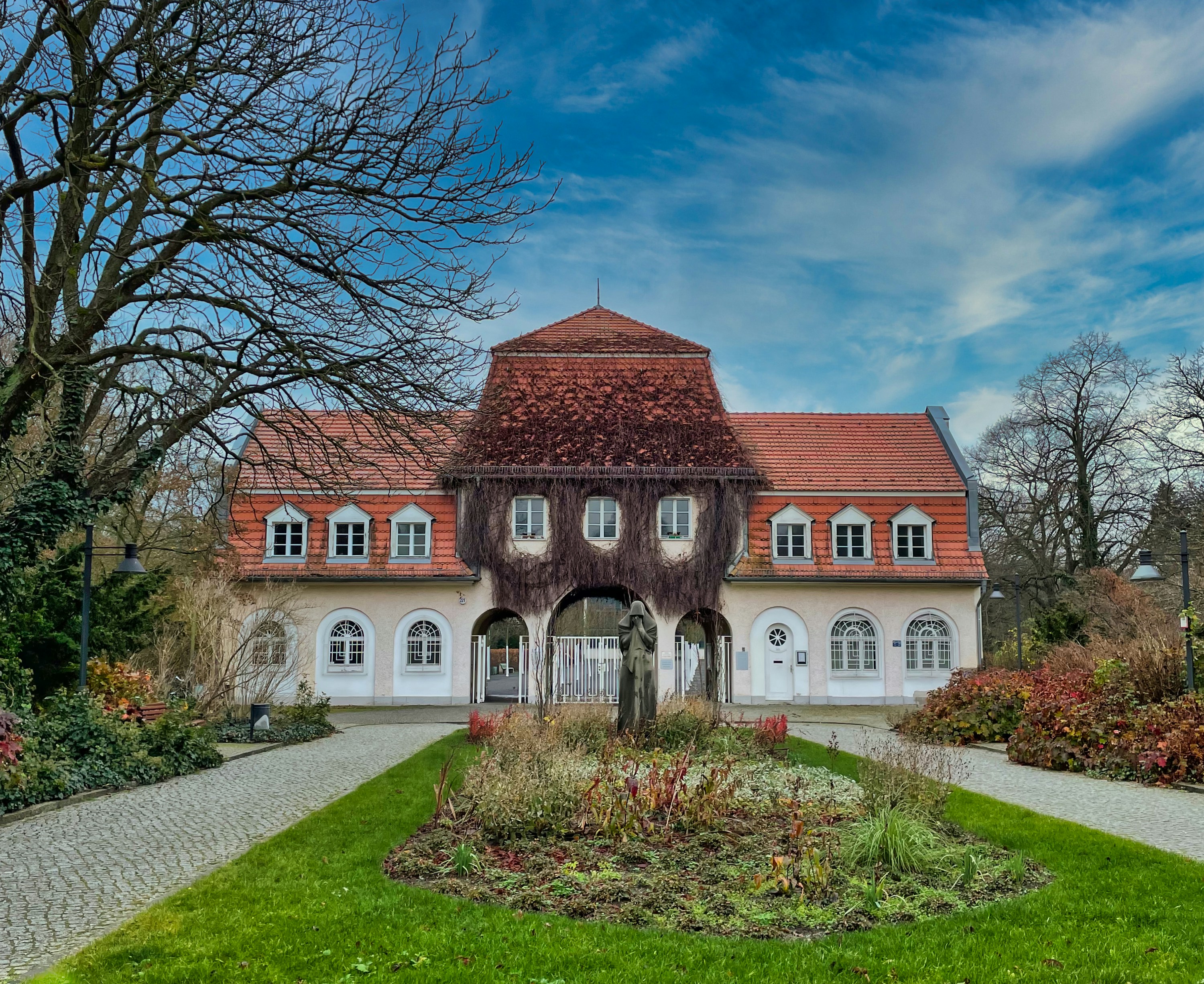 a large house with a garden in front of it