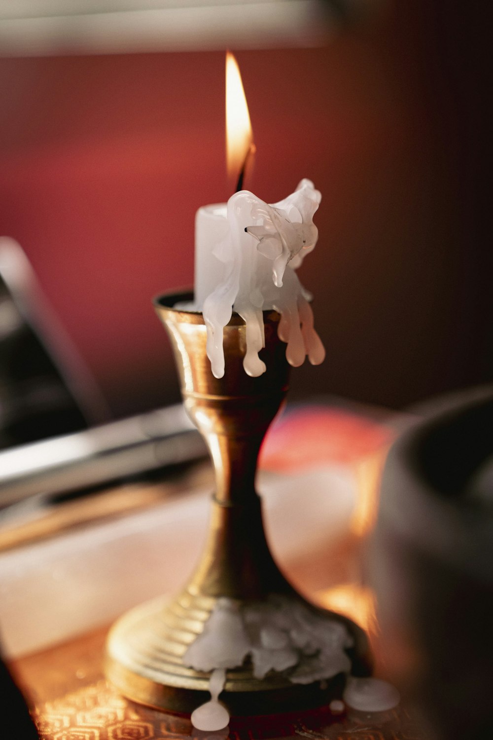 a lit candle with a flame