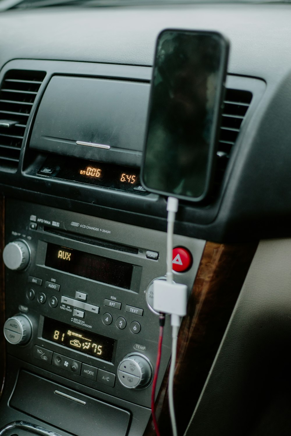 a car radio with a red button