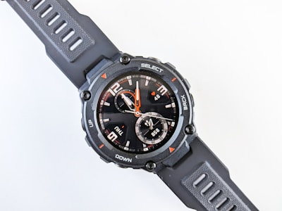 A sporty watch with a robust design and digital display.