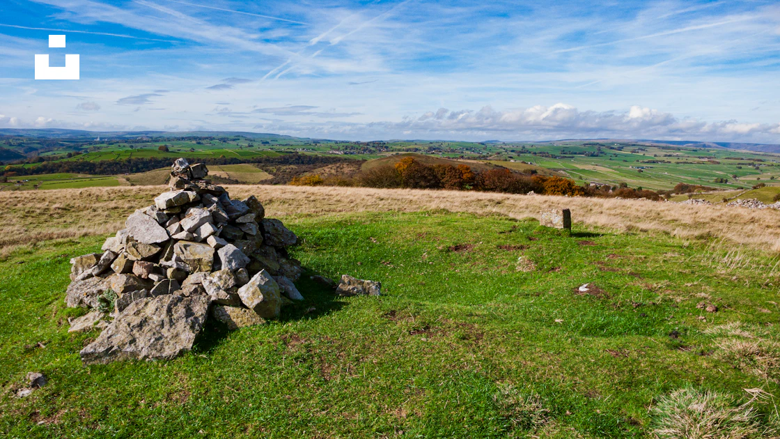 A pile of rocks in a field photo – Free Longstone moor Image on Unsplash
