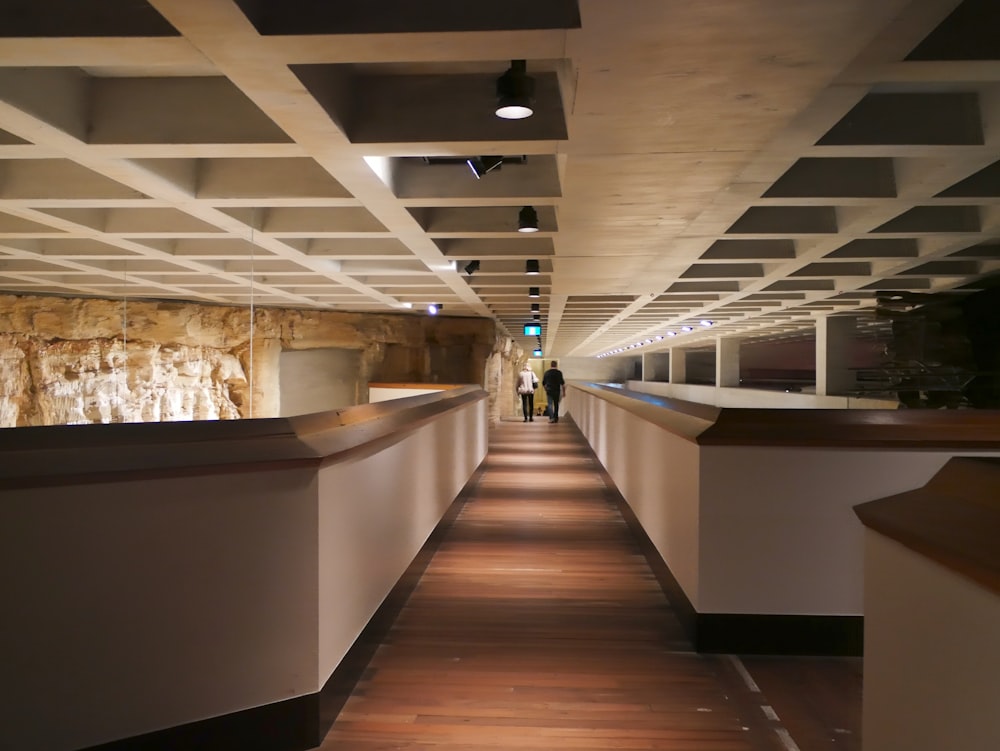 a long hallway with people walking