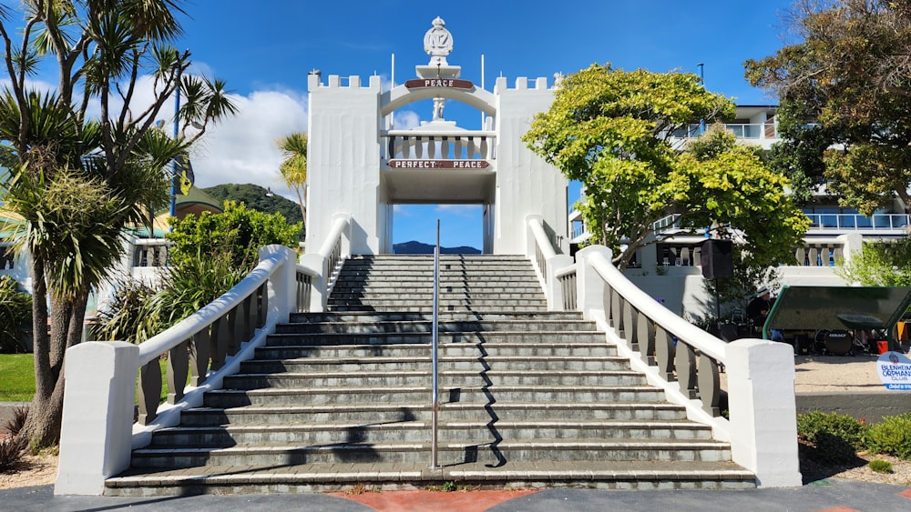 a building with stairs and trees