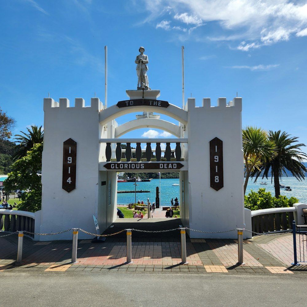 a white building with a statue on top