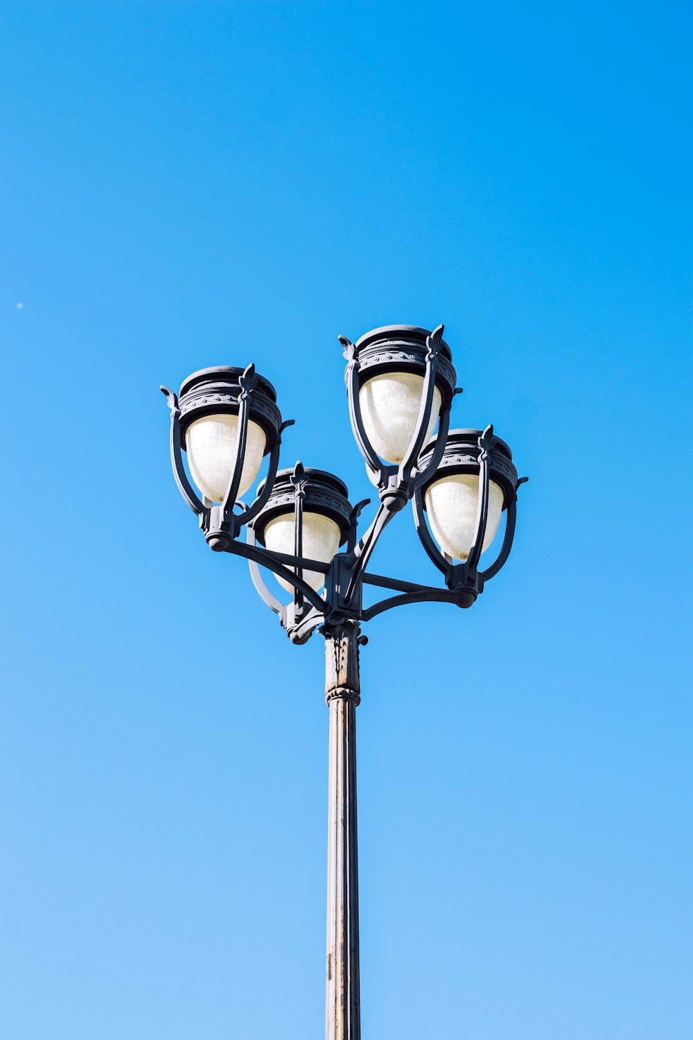 a light post with a blue sky