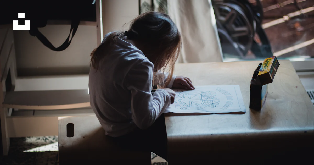 A person writing on a table photo – Free Cincinnati Image on Unsplash