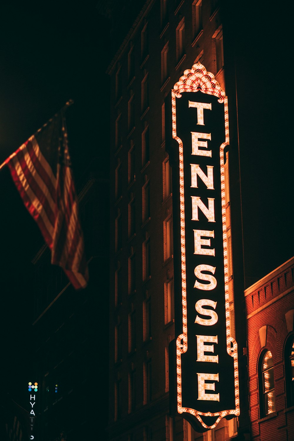 a tall sign with a flag