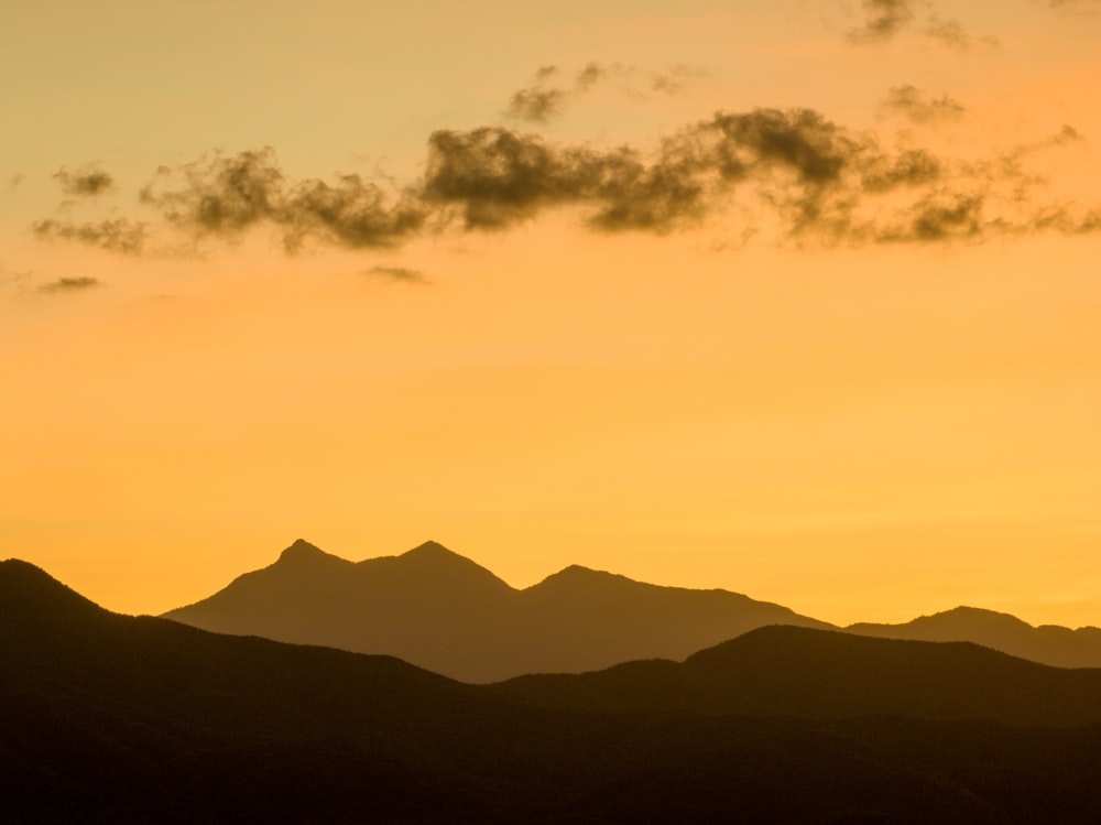 a landscape with hills and clouds