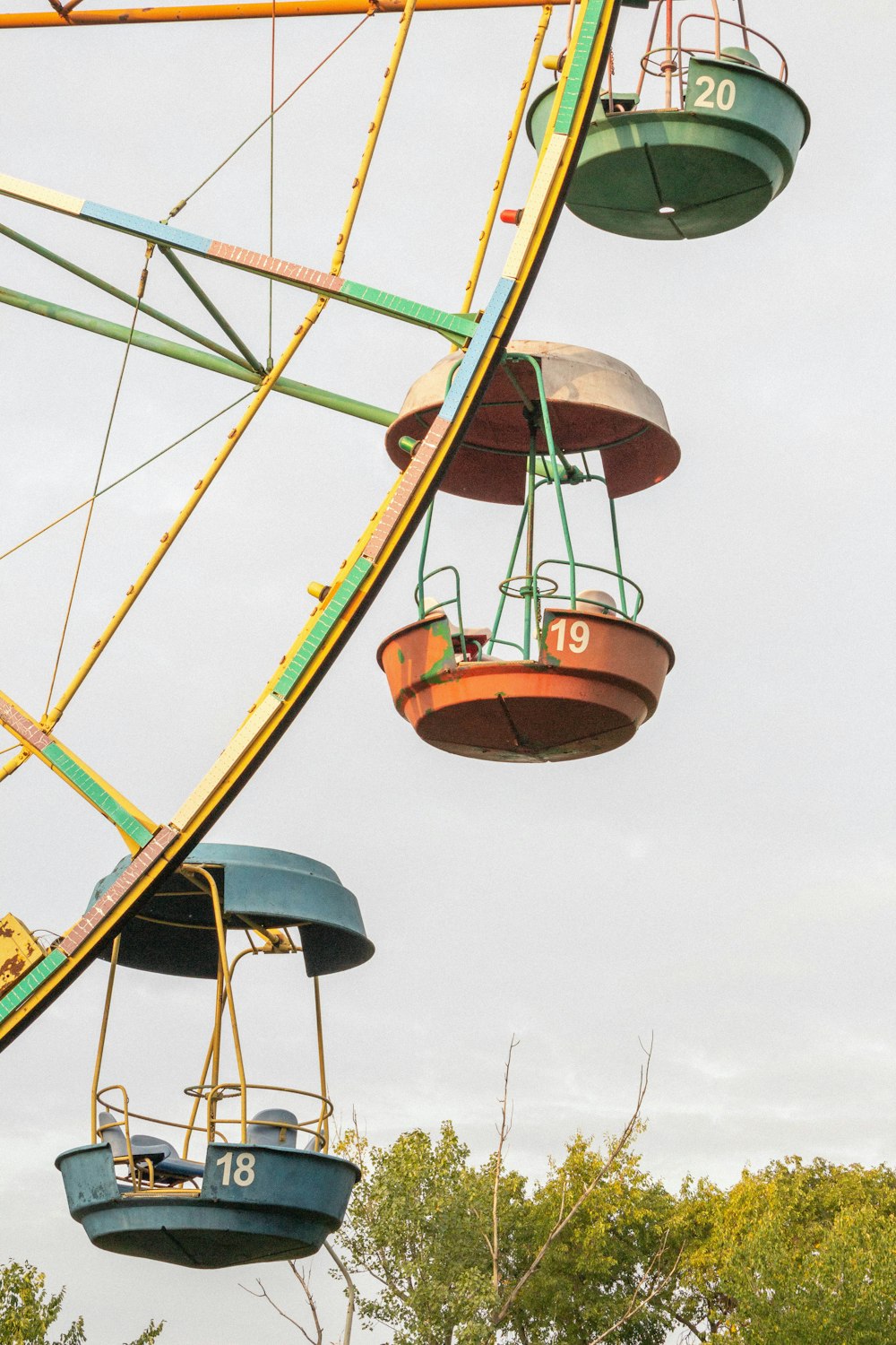 a ferris wheel with a couple of boats on it