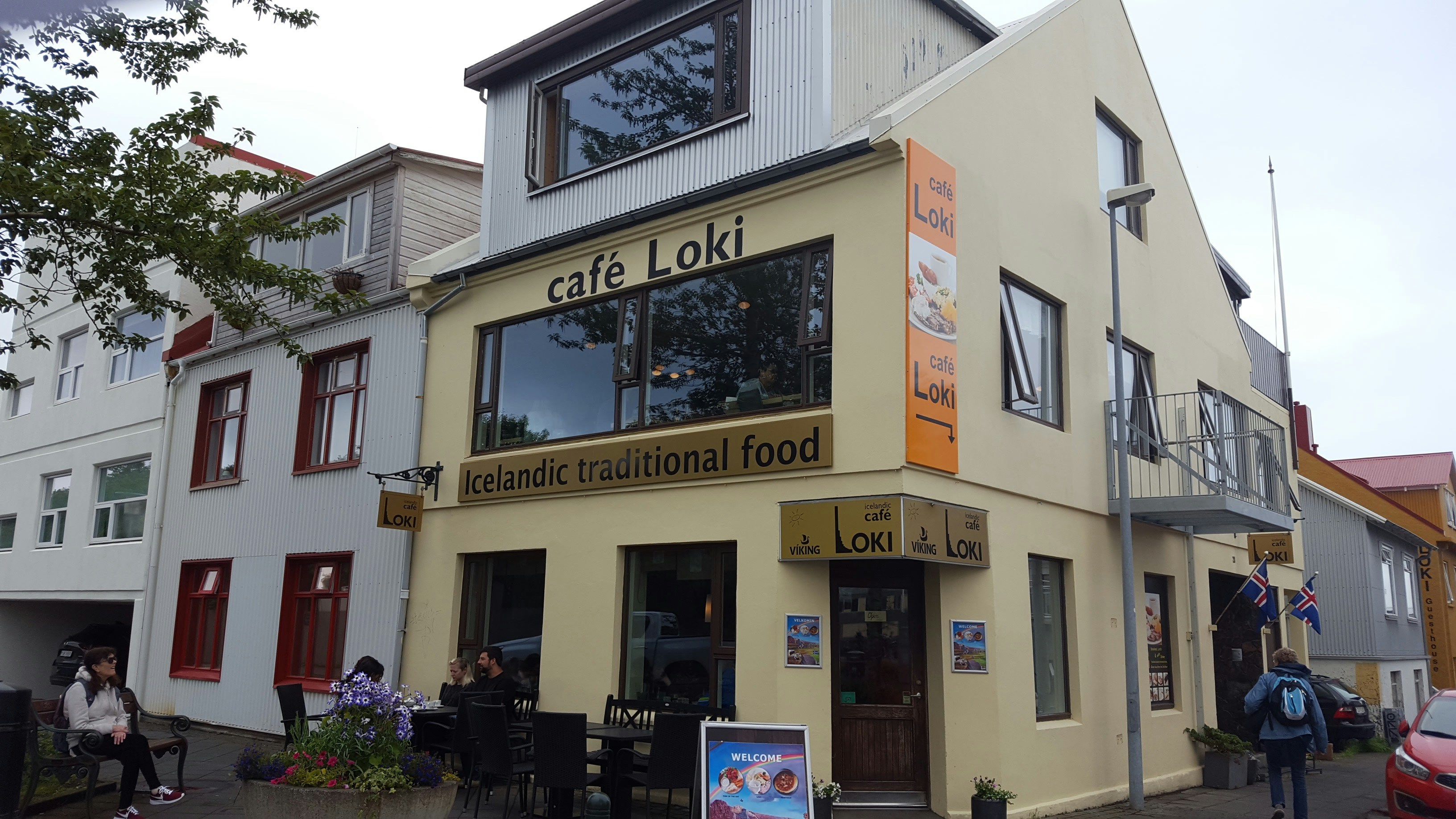 a yellow building with windows