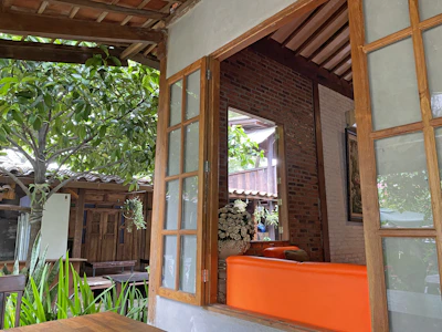 A cozy, open-air living room that blends indoor comfort with outdoor beauty.