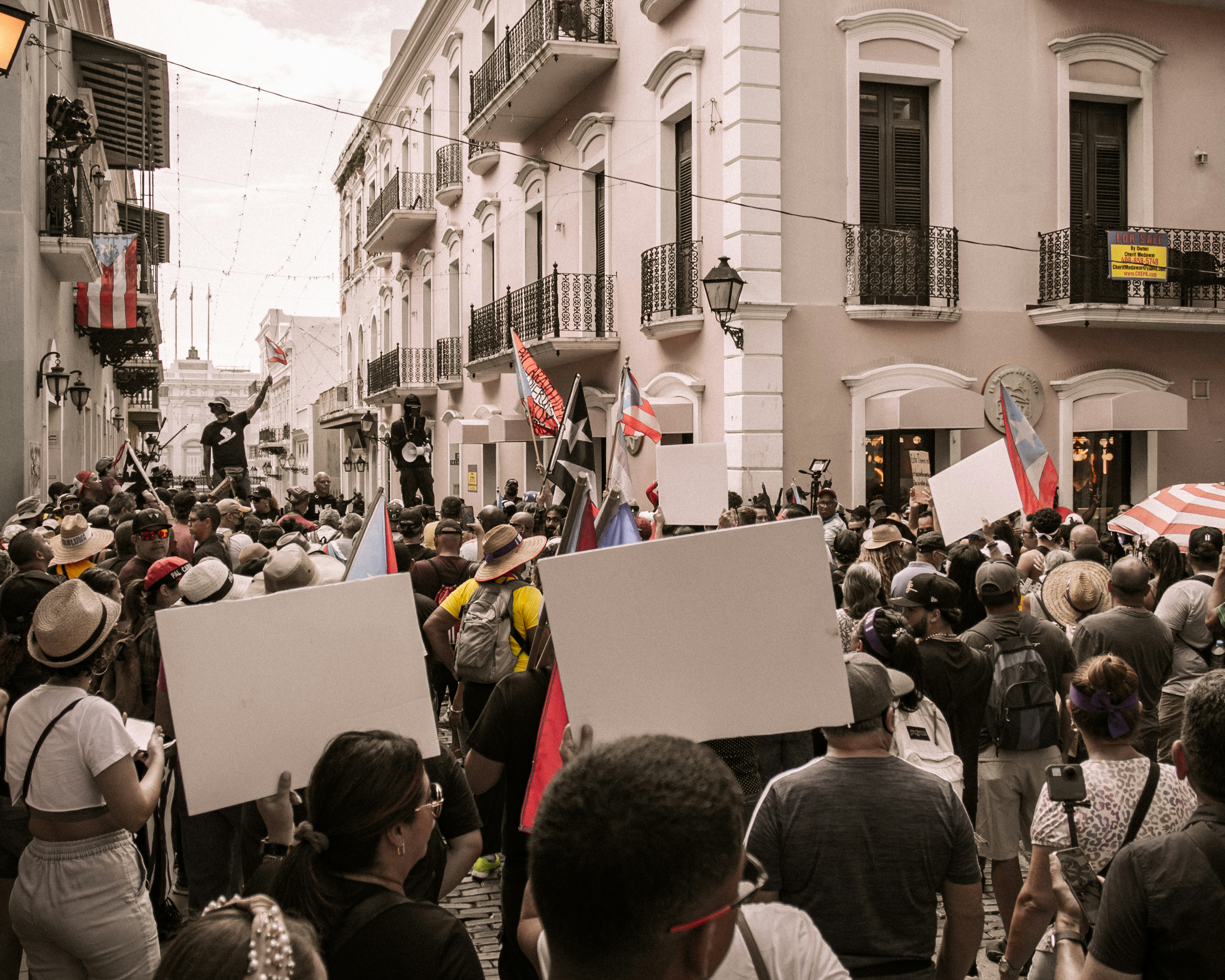 people on a street in protest in san juan puerto ric