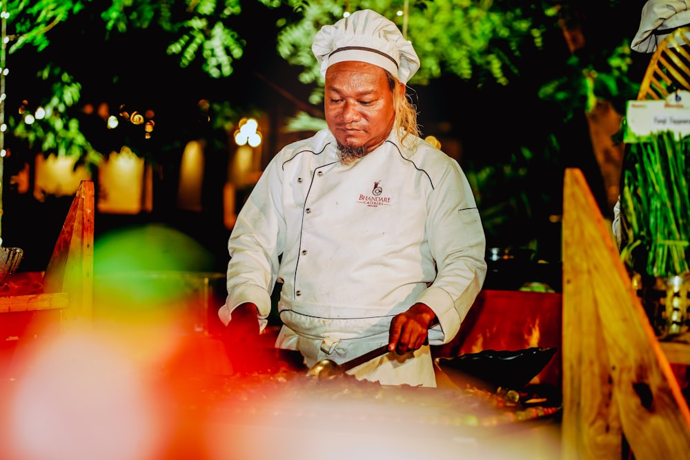 a man using a tool to cut a fire