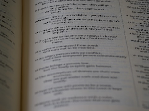 Close-up of an open book with clean, serif font on cream paper.