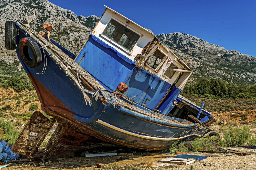 a wrecked boat on the ground