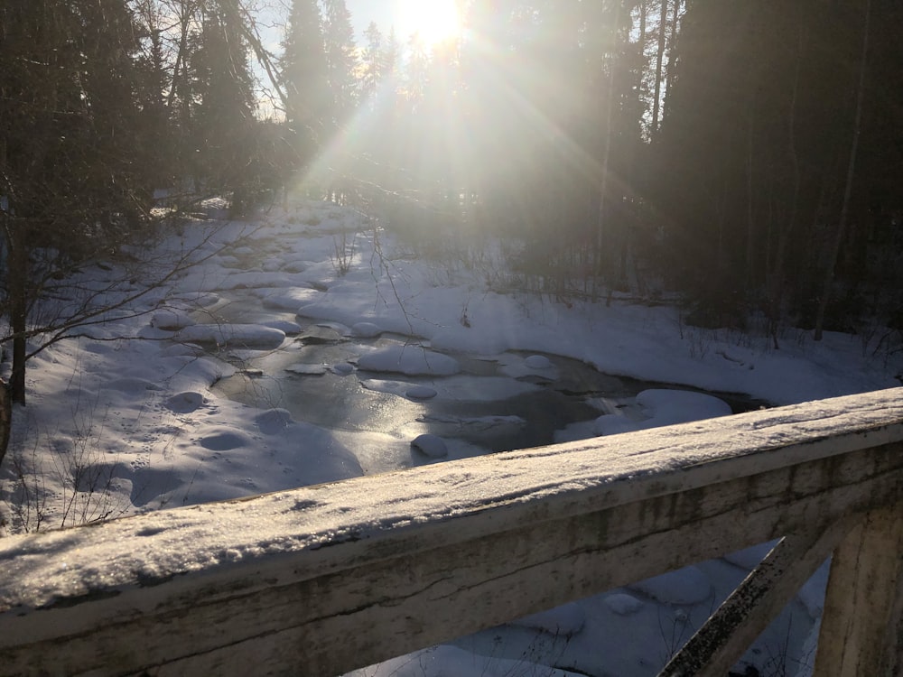 a river with snow on the banks