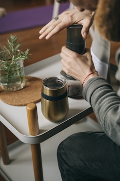 a person holding a can