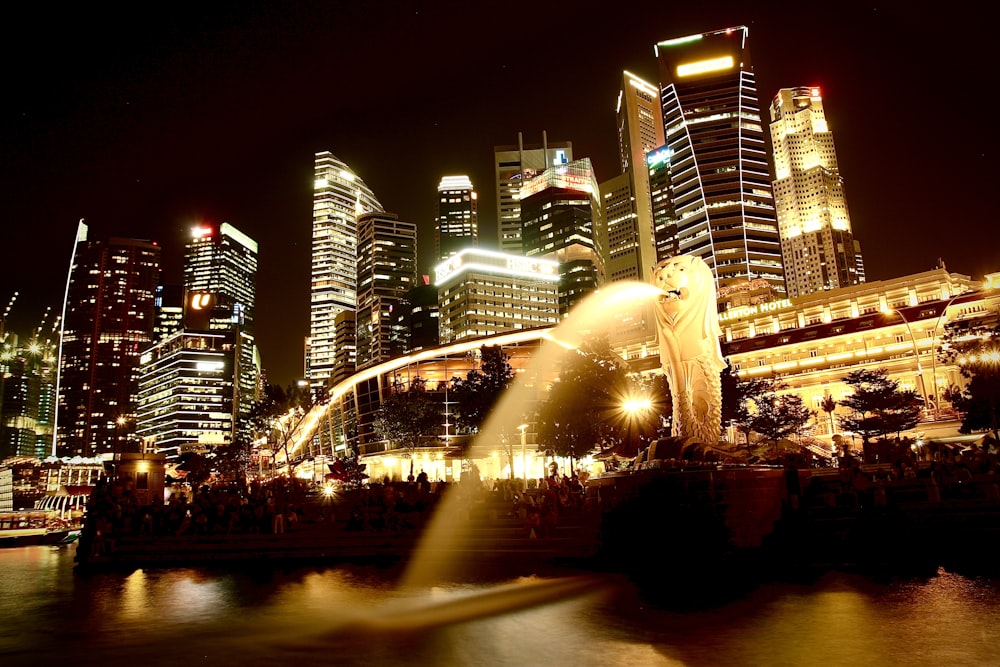 a city with a fountain and a statue in the middle