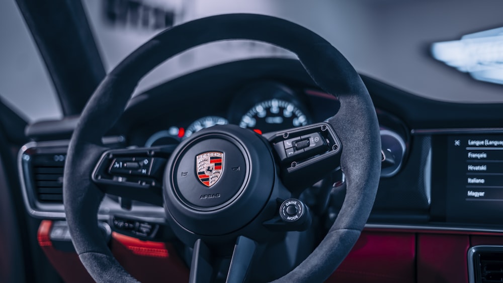 the steering wheel and dashboard of a car