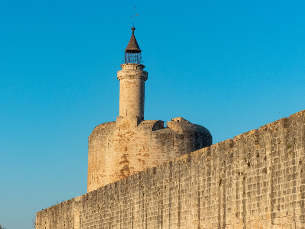 a stone wall with a tower