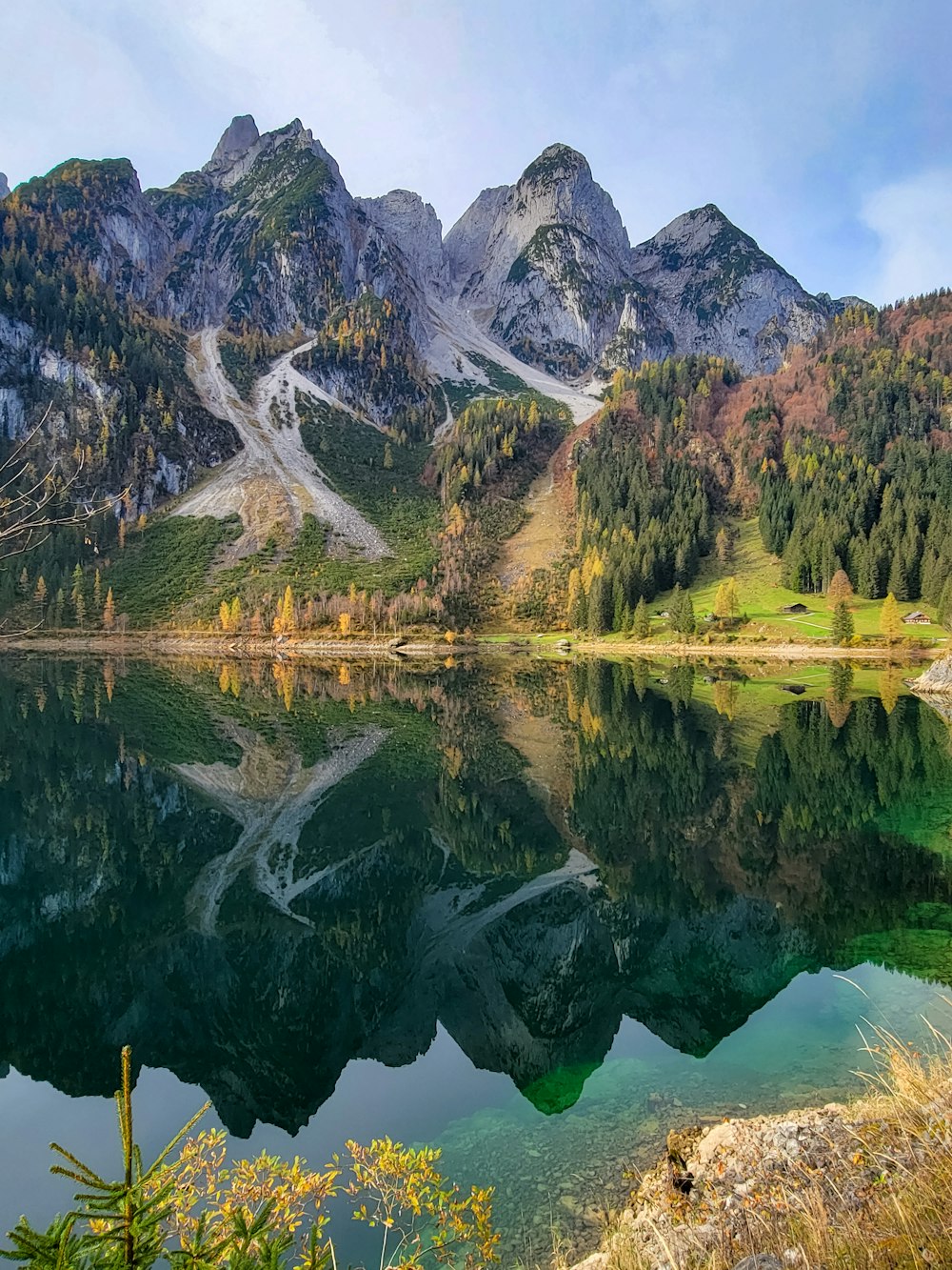 a lake with mountains in the background
