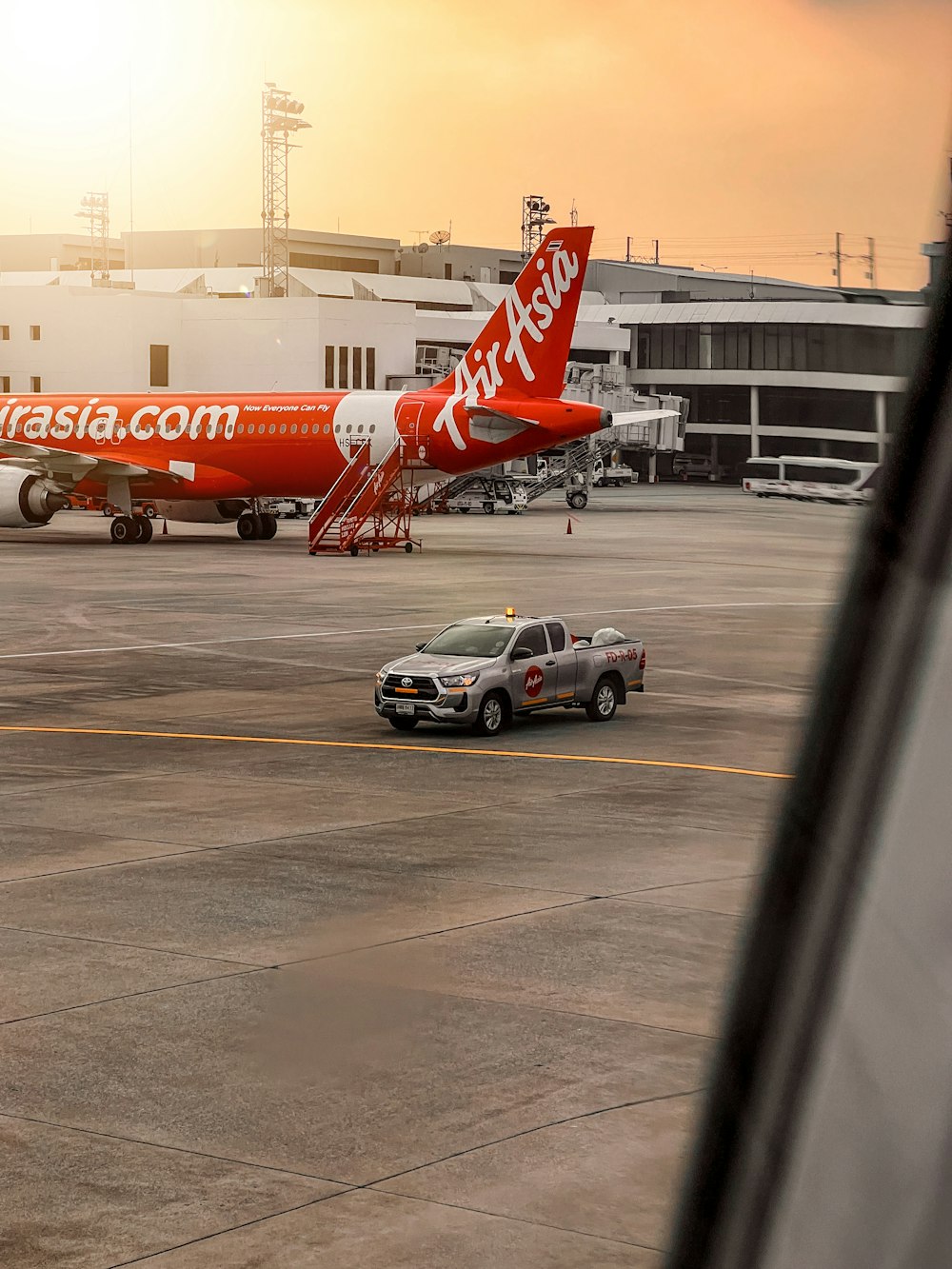 a car parked next to an airplane