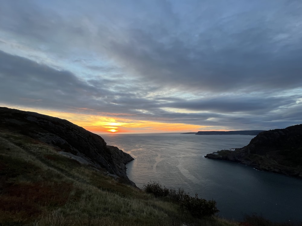 a sunset over a body of water