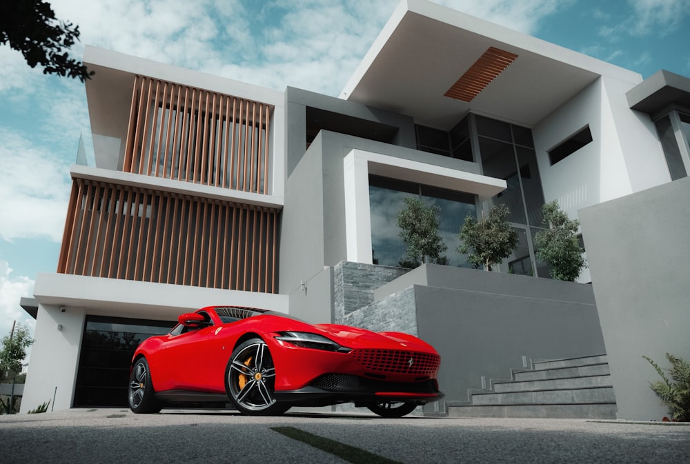 a red sports car parked outside a building