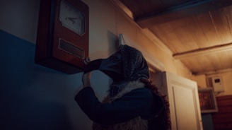 Professional expert carefully examining an old ornate clock in a traditional setting.