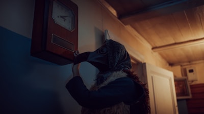 Professional expert carefully examining an old ornate clock in a traditional setting.