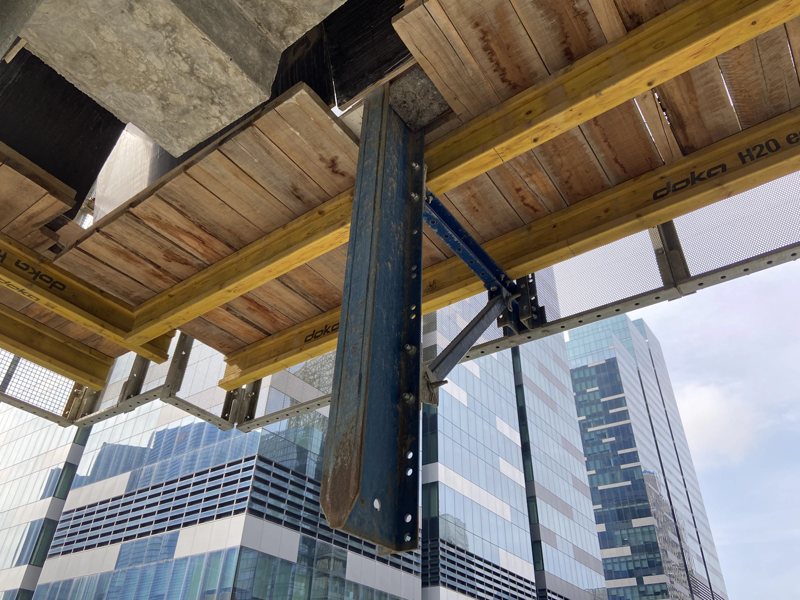Suspended slab formwork on props with the city skyline behind