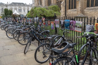 The podcast bike parked at a local event with banners about social ecology.