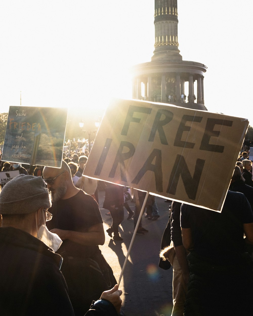 a group of people holding a sign