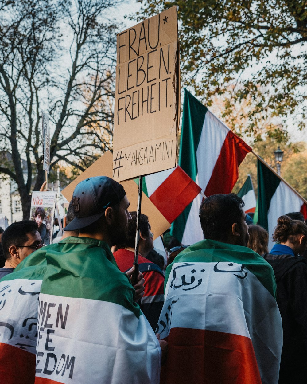 a group of people holding flags