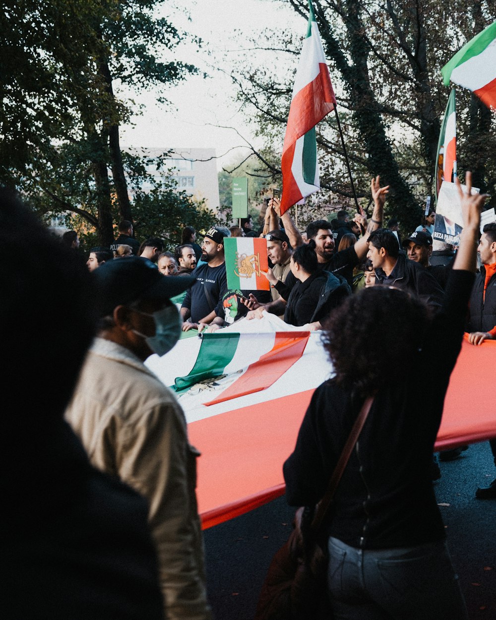 a group of people holding flags