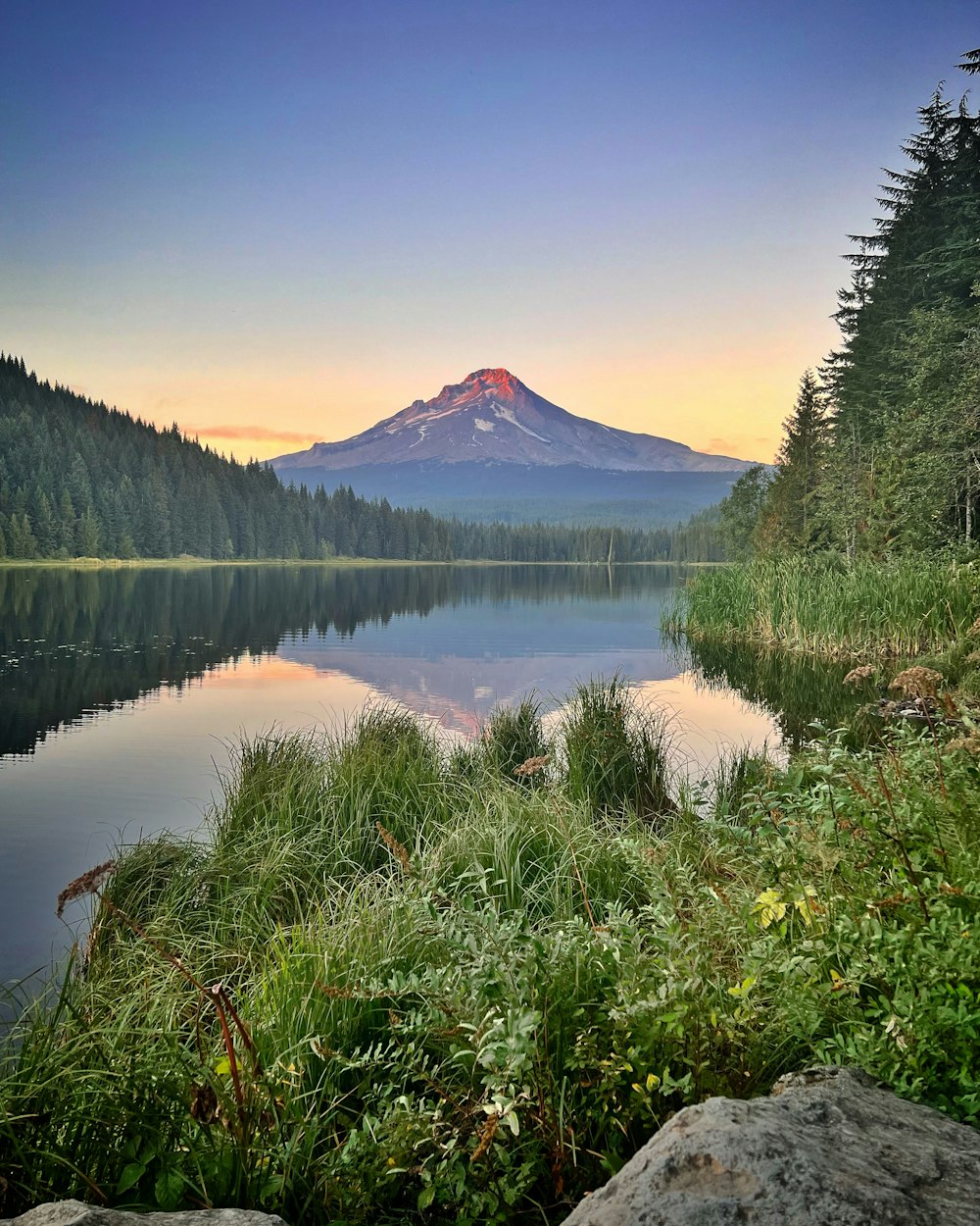 a lake with a mountain in the background