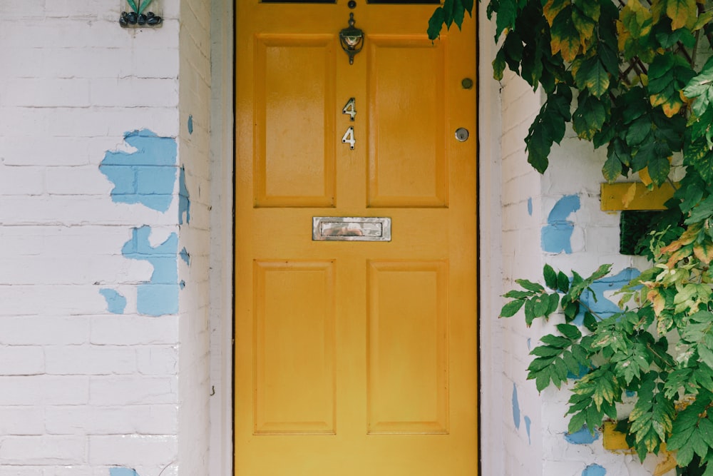 a yellow door with a light on it