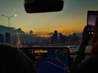 A sunset view of a nexofix vehicle arriving on time at a busy city location.