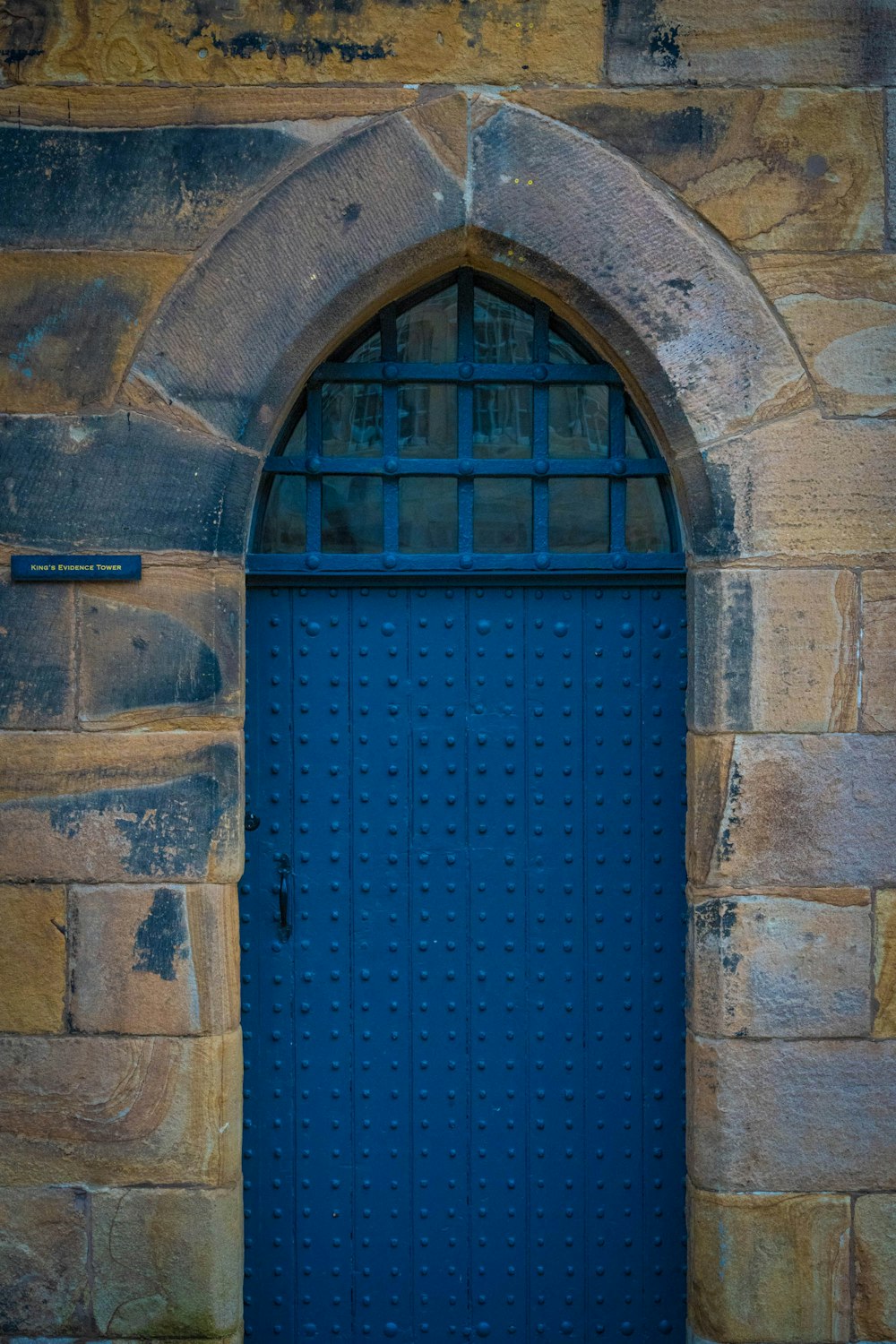 a blue door in a brick building