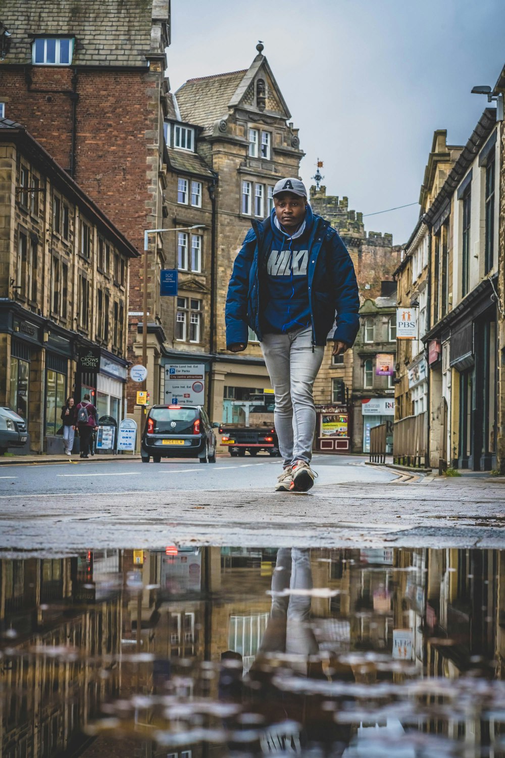 a man on a skateboard in the rain