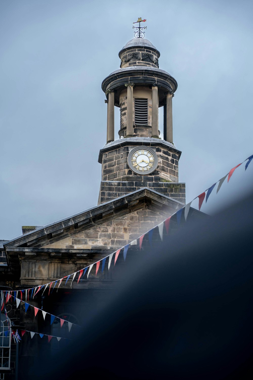 a clock tower on a bridge