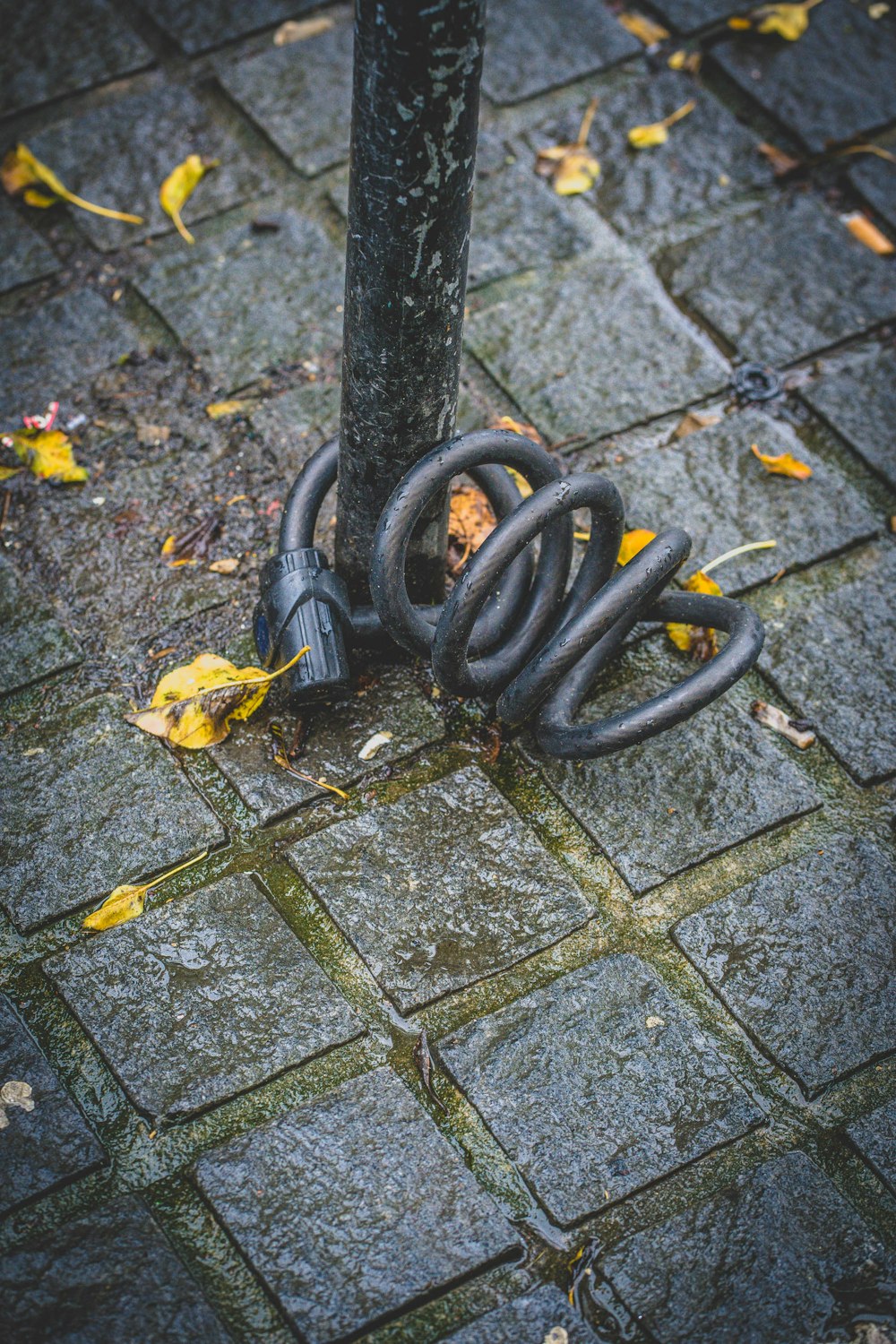 a metal object on a sidewalk