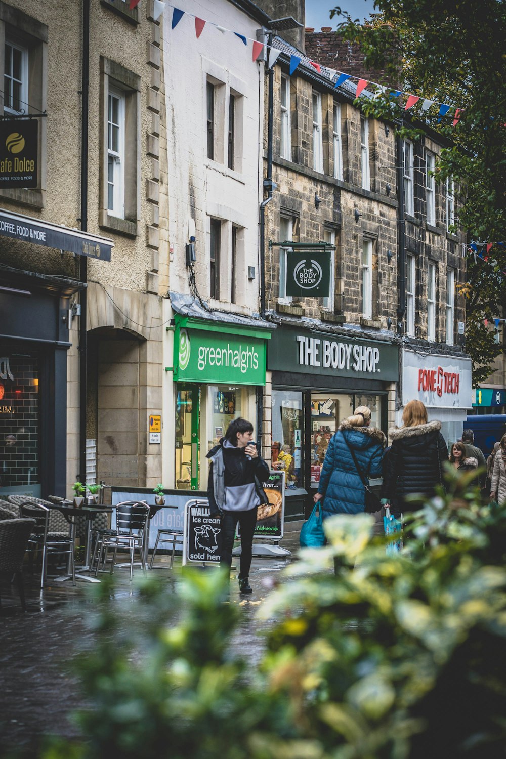 a group of people walking down a street