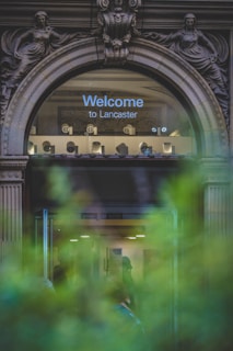 a glass door with a sign above it