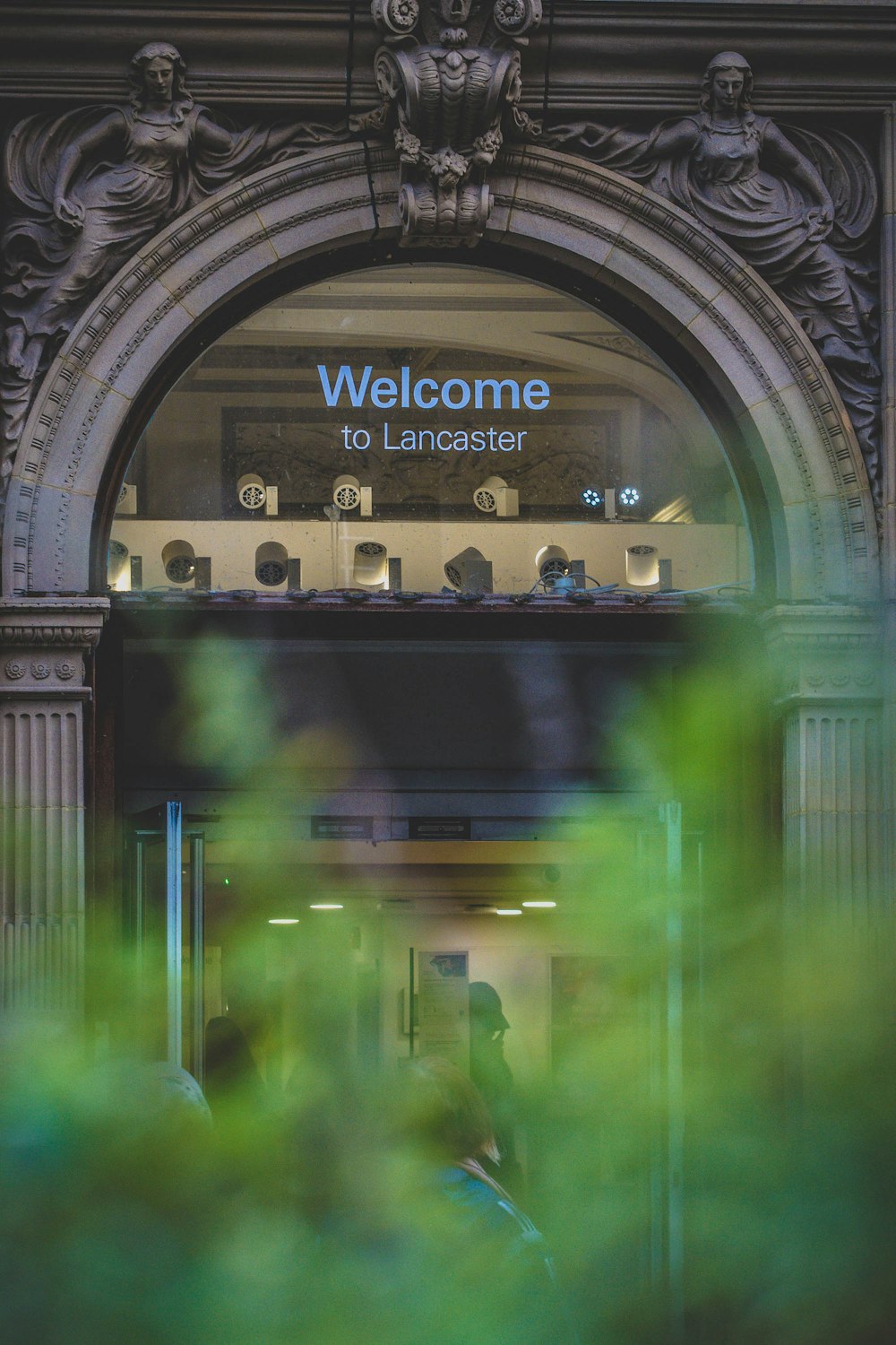 a glass door with a sign above it