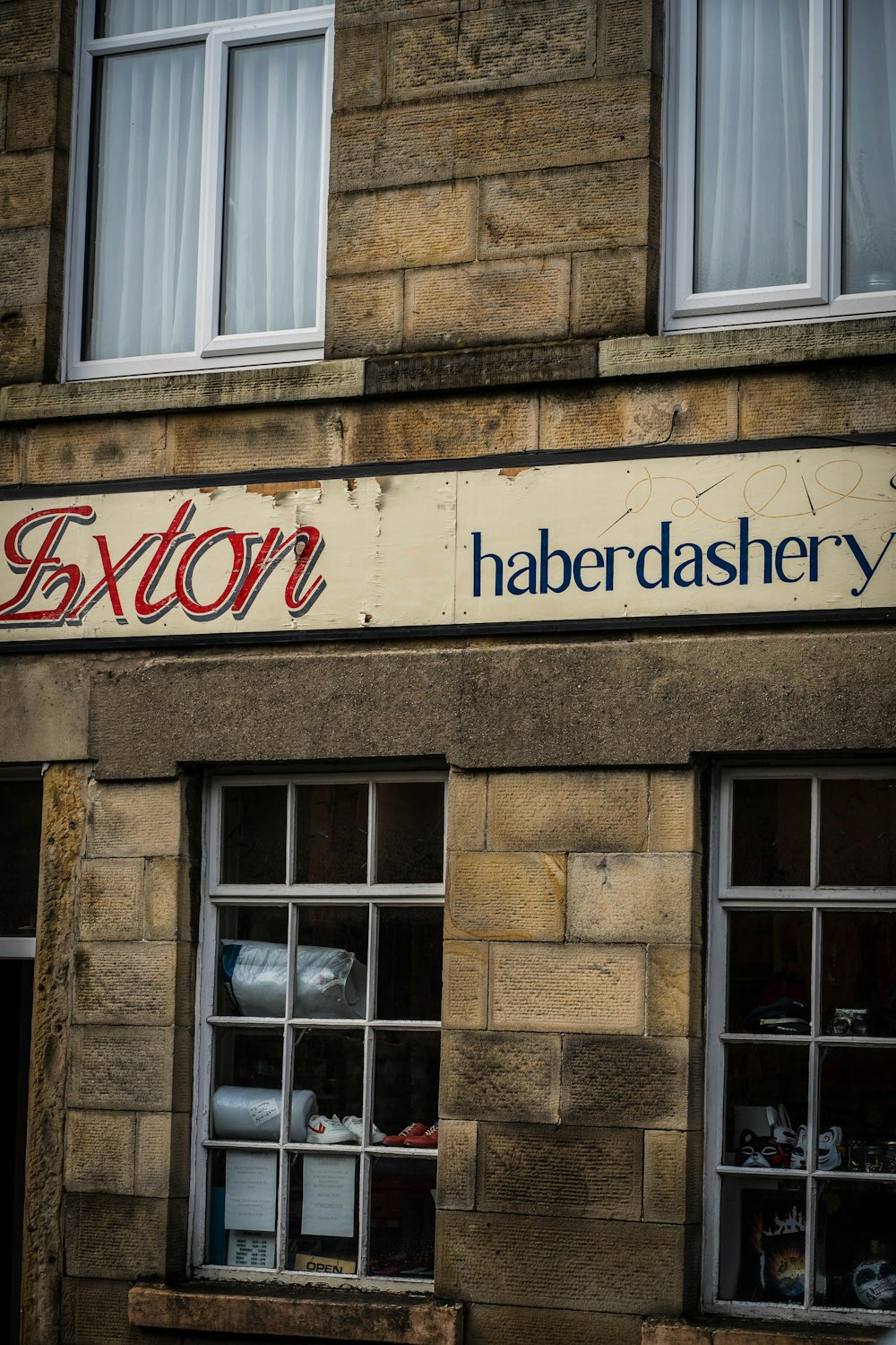 a building with windows and a sign on the side