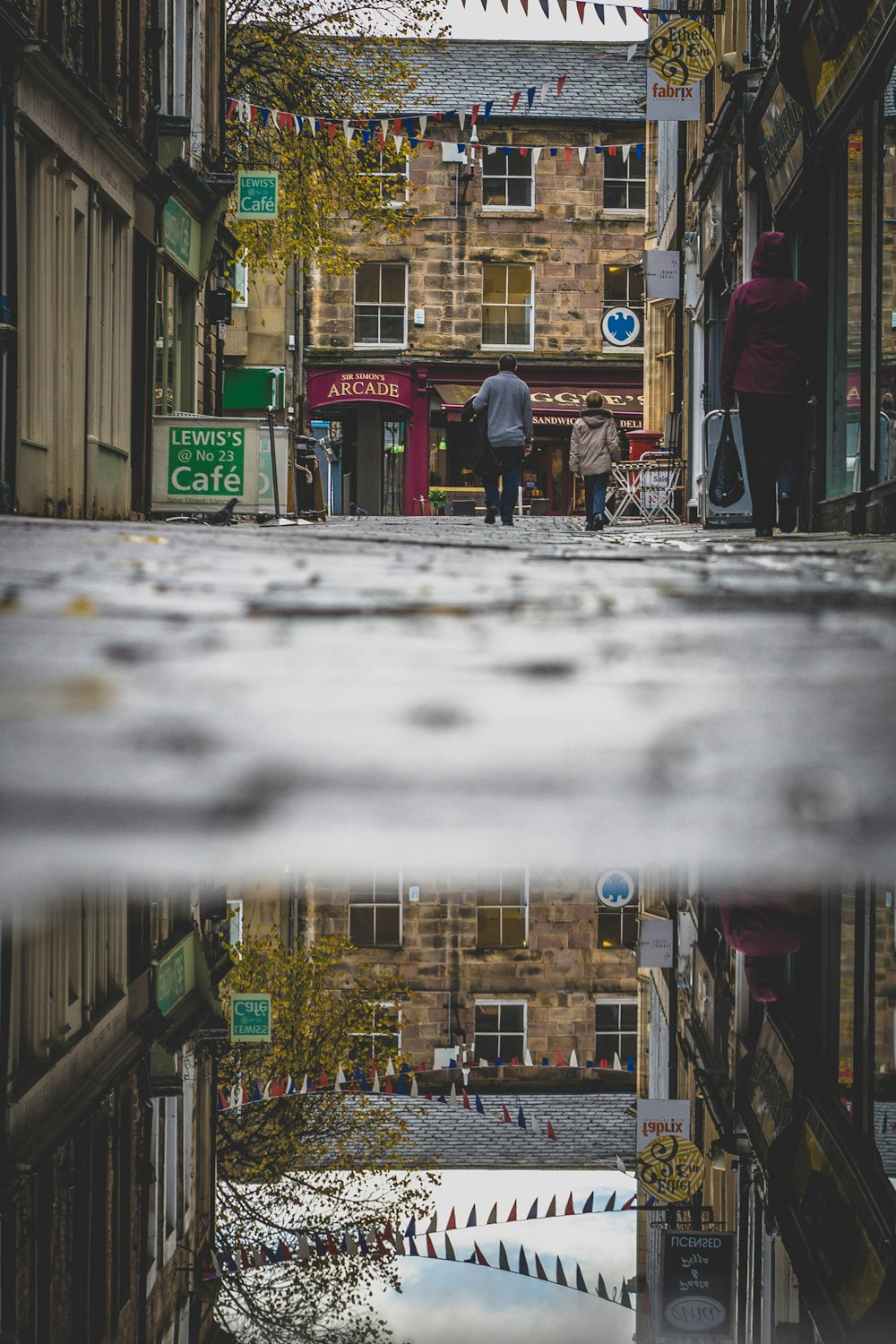 a collage of a street with buildings and people