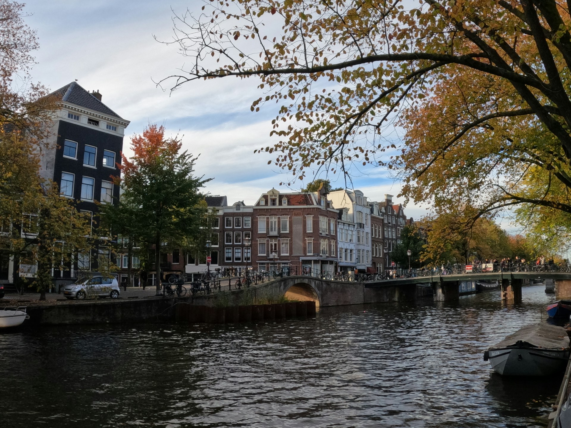 a river with a bridge and buildings
