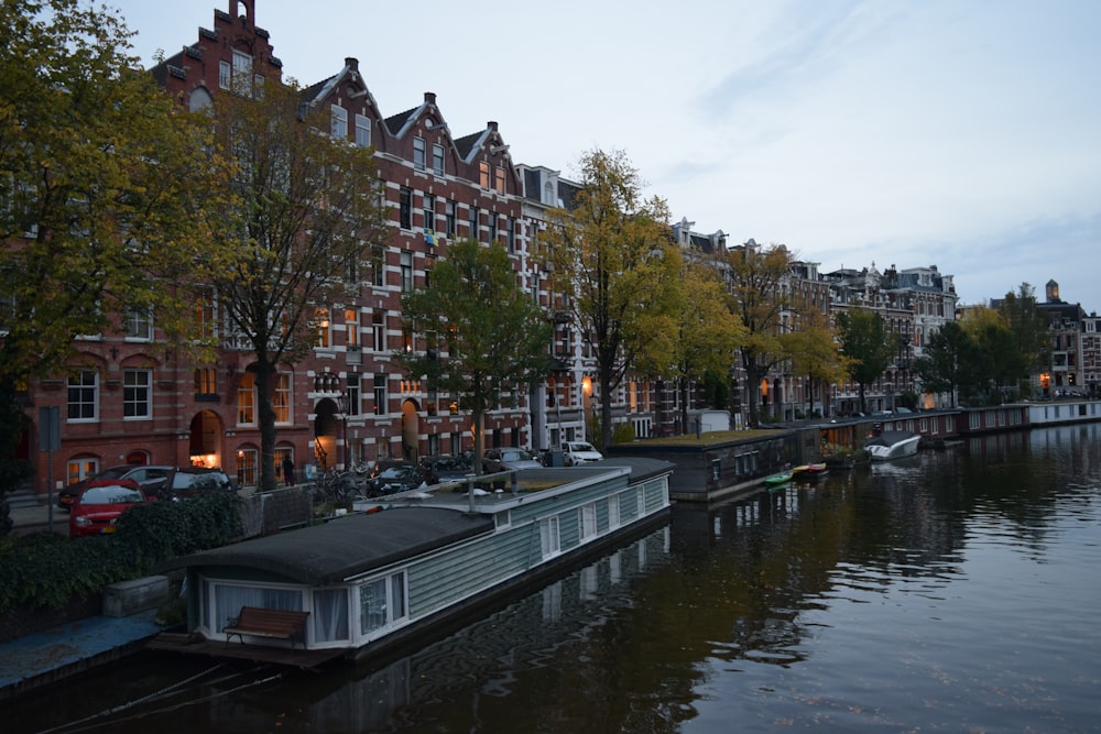 a canal with boats and buildings along it